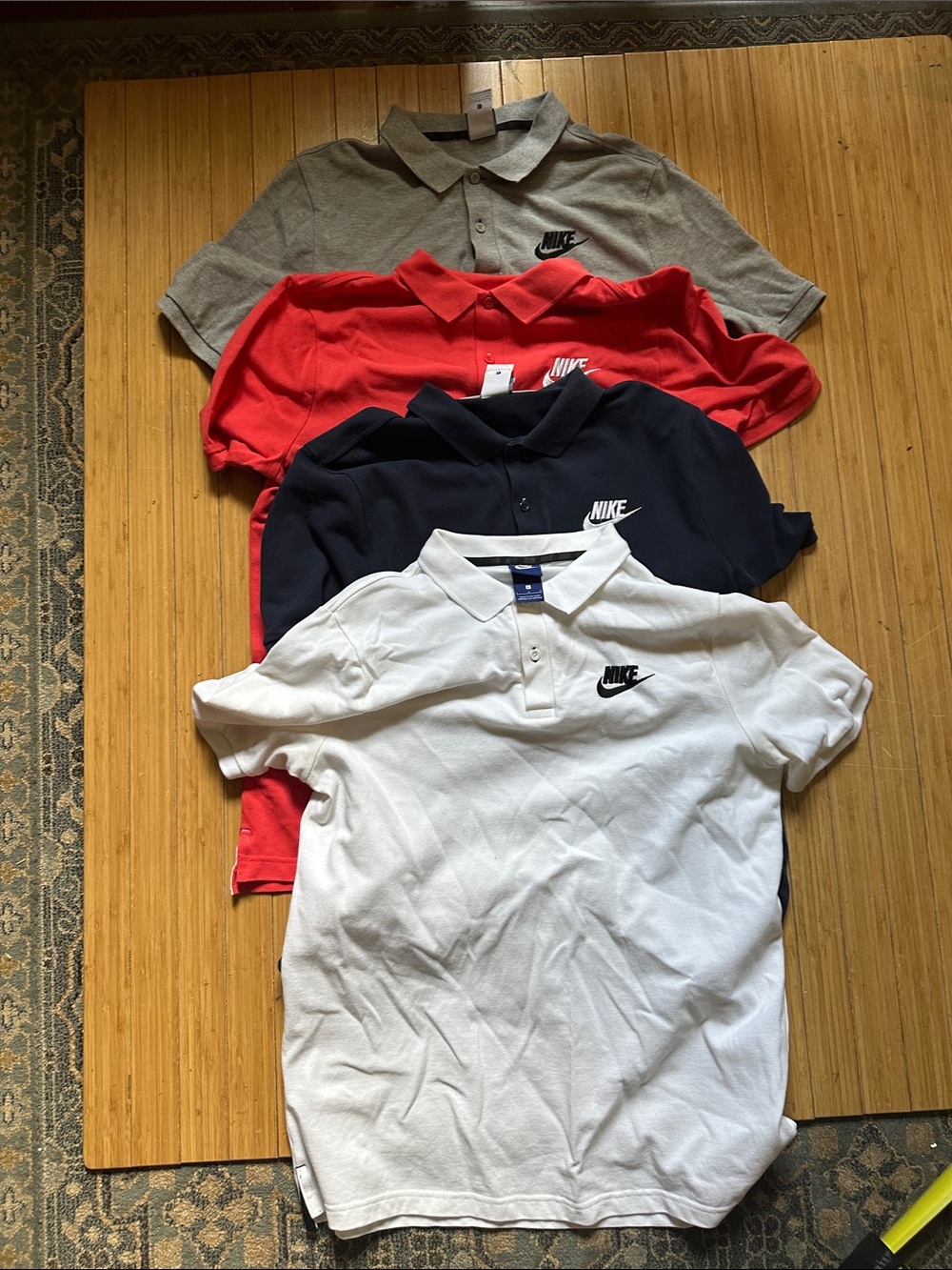 (4) Nike Men’s Polo’s - Navy, Fuchsia, Gray & white Swoosh Pack size Large